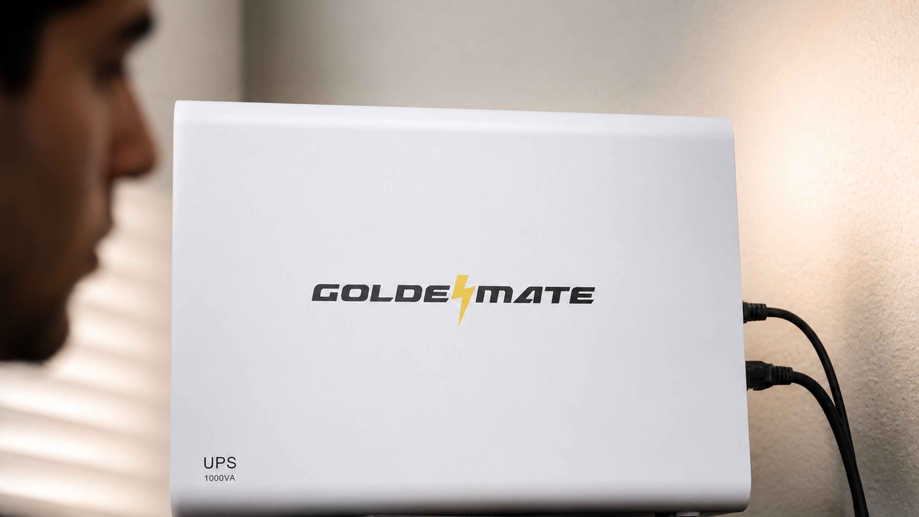 GoldenMate LiFePO4 UPS in a home workspace, desktop newsroom hero